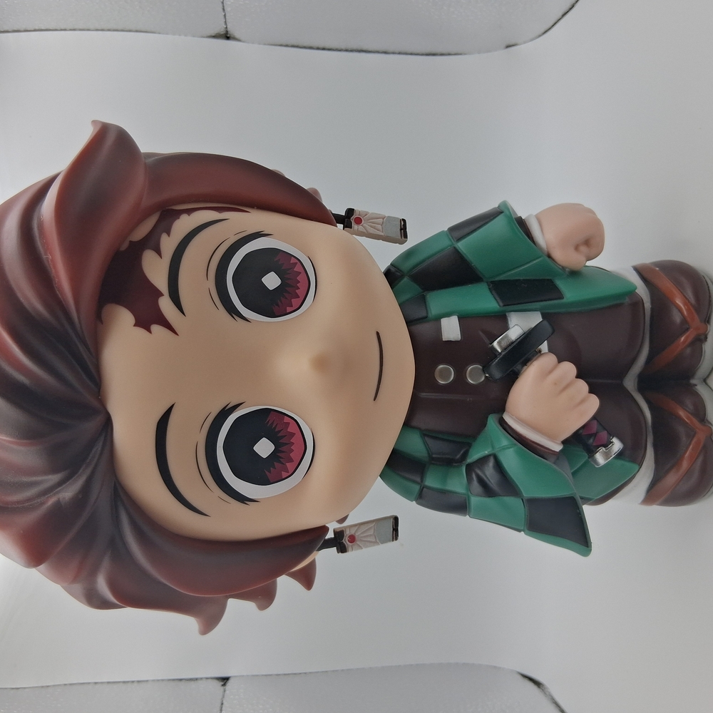 Anime Character Figure with Green and Brown Outfit